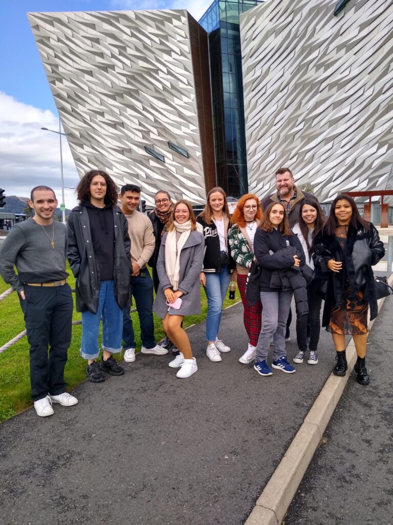 Dr Charles Hancock and the students standing outside the Titanic Museum Experience in Belfast
